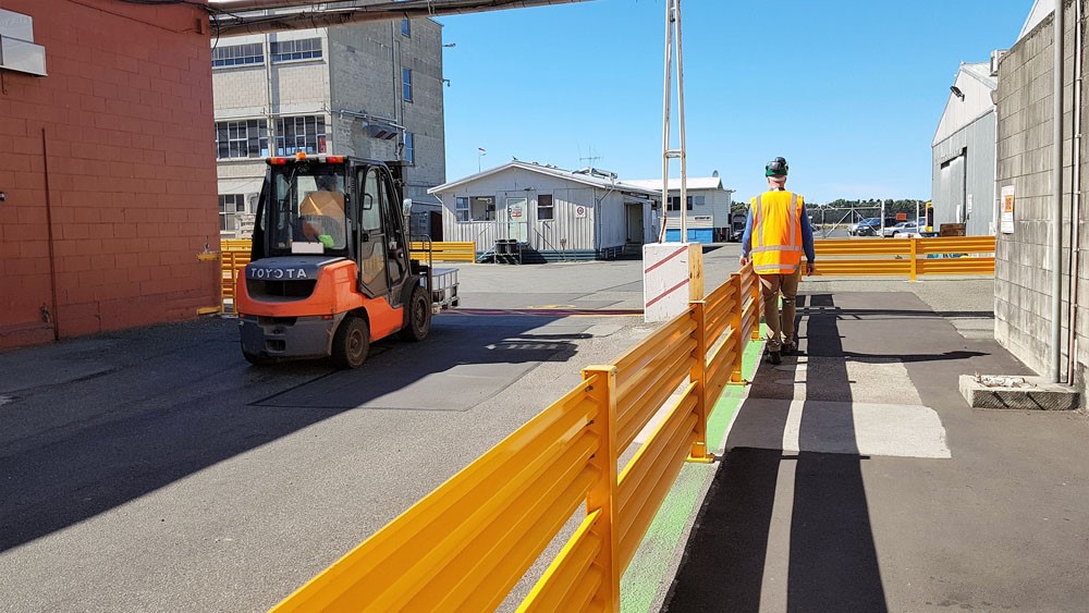 Worker is safely protected from forklift traffic with new barrier